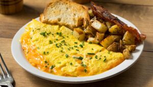 Cheese omelet served with side of American potatoes from breakfast menu at Wheaton Family Restaurant in Eau Claire, WI