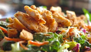 Fresh garden greens salads topped with crispy chicken served at Wheaton Family Restaurant in Eau Claire, WI
