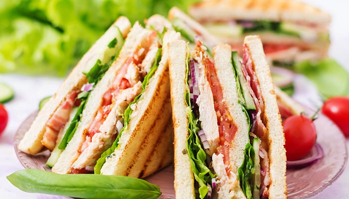 Triple decker turkey or chicken sandwich served at Wheaton Family Restaurant in Eau Claire, WI